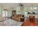 Open concept living area with hardwood floors and kitchen access at 1116 Flora Vista St, Trinity, FL 34655