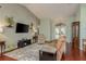 Living room with hardwood floors, vaulted ceiling, and neutral decor at 1116 Flora Vista St, Trinity, FL 34655