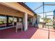 Spacious screened-in porch with seating area and view of backyard at 1116 Flora Vista St, Trinity, FL 34655