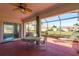 Relaxing screened porch with patio furniture and ceiling fan at 1116 Flora Vista St, Trinity, FL 34655