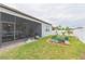 Screened patio and garden with various plants at 11714 Sunburst Marble Rd, Riverview, FL 33579