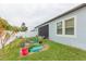 Backyard with a screened patio and flourishing garden at 11714 Sunburst Marble Rd, Riverview, FL 33579