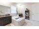Bathroom with large soaking tub, double vanity, and lots of storage at 11714 Sunburst Marble Rd, Riverview, FL 33579