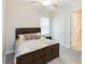 Comfortable bedroom with a king-size bed and ensuite bathroom at 11714 Sunburst Marble Rd, Riverview, FL 33579