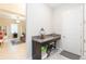 Convenient entryway drop zone with granite countertop and storage at 11714 Sunburst Marble Rd, Riverview, FL 33579