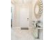 Bright entryway with tiled floors, console table, and large mirror at 11714 Sunburst Marble Rd, Riverview, FL 33579