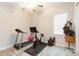 Home gym with treadmill, exercise bike, and weights at 11714 Sunburst Marble Rd, Riverview, FL 33579