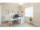 Home office features a desk, computer, and ample natural light at 11714 Sunburst Marble Rd, Riverview, FL 33579