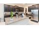 Modern kitchen with dark cabinetry, granite countertops, and stainless steel appliances at 11714 Sunburst Marble Rd, Riverview, FL 33579