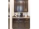 Kitchen with dark cabinetry and granite countertops at 11714 Sunburst Marble Rd, Riverview, FL 33579