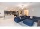 Bright living room with sectional sofa and kitchen views at 11714 Sunburst Marble Rd, Riverview, FL 33579