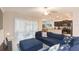 Relaxing living room featuring a sectional sofa and sliding glass doors at 11714 Sunburst Marble Rd, Riverview, FL 33579
