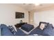 Open living space with sectional sofa and access to patio at 11714 Sunburst Marble Rd, Riverview, FL 33579