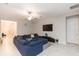 Spacious living area with sectional sofa and large TV at 11714 Sunburst Marble Rd, Riverview, FL 33579
