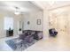 Living room with sectional sofa, ottomans, and wine cooler at 11714 Sunburst Marble Rd, Riverview, FL 33579