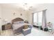 Main bedroom with plush bed, nightstands and ample natural light at 11714 Sunburst Marble Rd, Riverview, FL 33579