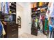 Well-organized walk-in closet with shelving and hanging space at 11714 Sunburst Marble Rd, Riverview, FL 33579