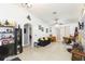 Open living room featuring tile floors, a sofa, and a dining table at 13508 Prestwick Dr, Riverview, FL 33579