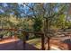 Deck with wooden railing overlooking serene landscape at 14708 Mayer Ave, Hudson, FL 34669