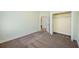 Bedroom with carpet flooring and closet at 1503 River Ct, Tarpon Springs, FL 34689