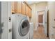 Laundry room with washer, dryer, and access to bathroom at 1503 River Ct, Tarpon Springs, FL 34689