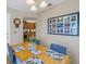 Dining area with wood table and view into kitchen at 1621 Watermark Ne Cir # 1621, St Petersburg, FL 33702