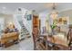 Bright dining area with a large table and chandelier, near staircase at 1621 Watermark Ne Cir # 1621, St Petersburg, FL 33702