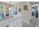 Upper hallway with access to bedrooms and balcony at 1621 Watermark Ne Cir # 1621, St Petersburg, FL 33702