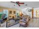 Open living area with ample seating, a fireplace, and a staircase at 1621 Watermark Ne Cir # 1621, St Petersburg, FL 33702