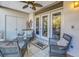 Relaxing patio with wicker furniture and access to the interior at 1621 Watermark Ne Cir # 1621, St Petersburg, FL 33702