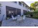 Cozy patio adjacent to the house, featuring a table and chairs at 1621 Watermark Ne Cir # 1621, St Petersburg, FL 33702