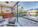 Enjoy a screened patio with outdoor seating and a view of the courtyard at 1621 Watermark Ne Cir # 1621, St Petersburg, FL 33702