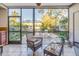 Sunroom with wicker furniture and view of patio at 1621 Watermark Ne Cir # 1621, St Petersburg, FL 33702
