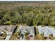 Aerial view of house and surrounding neighborhood at 1936 Grand Cypress Ln, Sun City Center, FL 33573