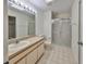 Clean bathroom with shower/tub combo and updated vanity at 1936 Grand Cypress Ln, Sun City Center, FL 33573