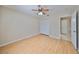 Bedroom with light wood flooring, double door closet and ceiling fan at 1936 Grand Cypress Ln, Sun City Center, FL 33573