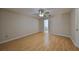 Large bedroom with wood-look floors and ensuite bathroom access at 1936 Grand Cypress Ln, Sun City Center, FL 33573