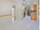 View of the dining area with kitchen access and tile floors at 1936 Grand Cypress Ln, Sun City Center, FL 33573