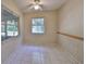 Bright dining area with large window and tile flooring at 1936 Grand Cypress Ln, Sun City Center, FL 33573