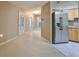 Clean entryway with view of kitchen and bathroom at 1936 Grand Cypress Ln, Sun City Center, FL 33573