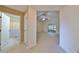 Bright hallway with doors to bathroom and other rooms at 1936 Grand Cypress Ln, Sun City Center, FL 33573