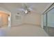 Spacious living room with sliding glass doors at 1936 Grand Cypress Ln, Sun City Center, FL 33573