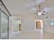 Spacious living room with high ceilings and ceiling fan at 1936 Grand Cypress Ln, Sun City Center, FL 33573