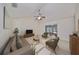 Living room with staged furniture and view of patio at 1936 Grand Cypress Ln, Sun City Center, FL 33573