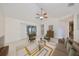 Living room with staged furniture and access to patio at 1936 Grand Cypress Ln, Sun City Center, FL 33573