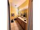 Bathroom with double sinks and a large mirror at 20841 Eustis Rd, Land O Lakes, FL 34637