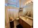 Clean bathroom with shower/tub combo and updated vanity at 20841 Eustis Rd, Land O Lakes, FL 34637