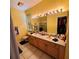 Bathroom with double sinks and a walk-in shower at 20841 Eustis Rd, Land O Lakes, FL 34637