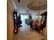 Open dining room with a glass-top table and view to the living room at 20841 Eustis Rd, Land O Lakes, FL 34637