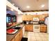 Kitchen with light wood cabinets and a double sink at 20841 Eustis Rd, Land O Lakes, FL 34637